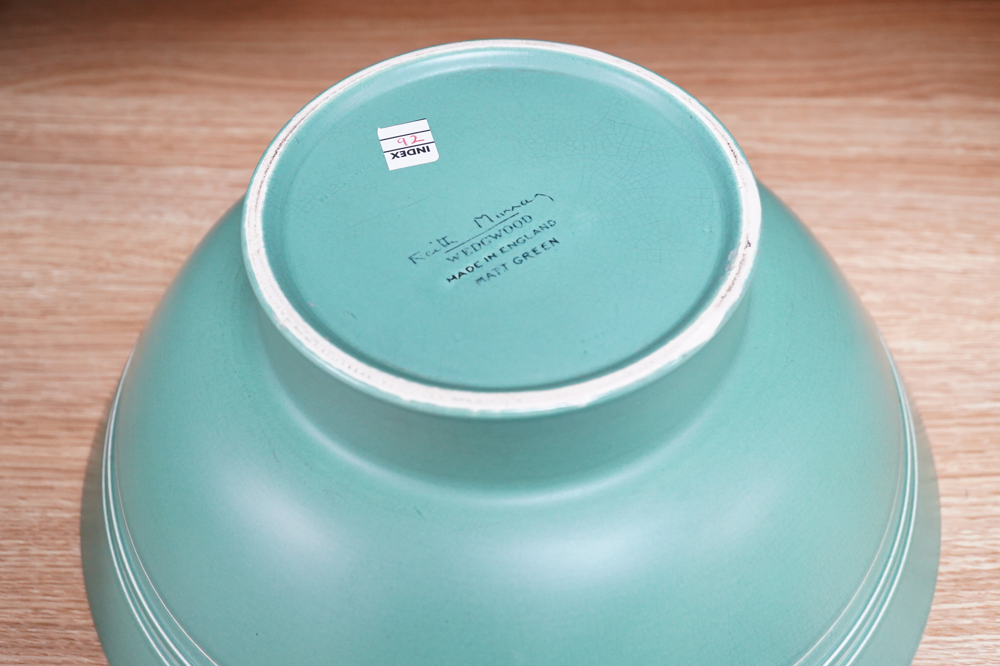 Keith Murray for Wedgwood green glazed footed bowl, 28cm in diameter